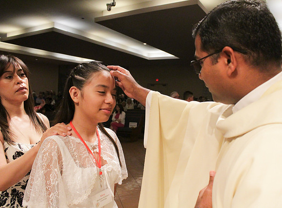 Holy Saturday At the Easter Vigil in the Holy Night of Easter at St. Patrick Community Church
