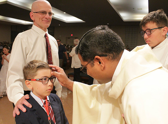 Holy Saturday At the Easter Vigil in the Holy Night of Easter at St. Patrick Community Church