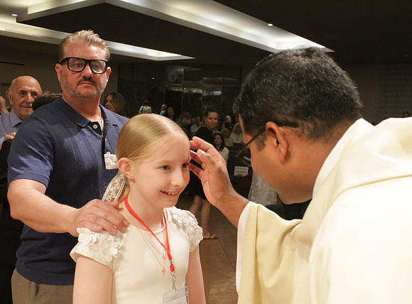 Holy Saturday At the Easter Vigil in the Holy Night of Easter at St. Patrick Community Church