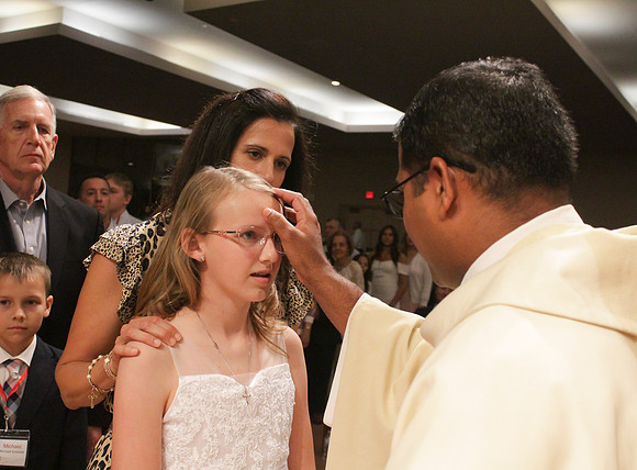 Holy Saturday At the Easter Vigil in the Holy Night of Easter at St. Patrick Community Church
