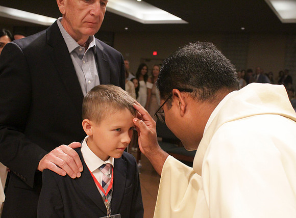 Holy Saturday At the Easter Vigil in the Holy Night of Easter at St. Patrick Community Church