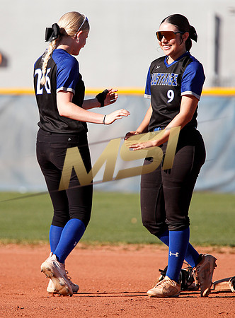 The  West Point Dragons girls softball team take on the Dobson Mustangs
