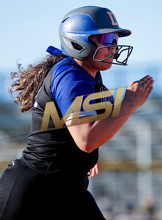 The  West Point Dragons girls softball team take on the Dobson Mustangs