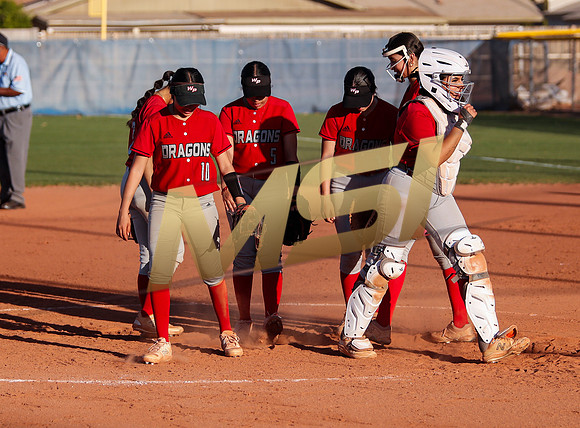 The  West Point Dragons girls softball team take on the Dobson Mustangs