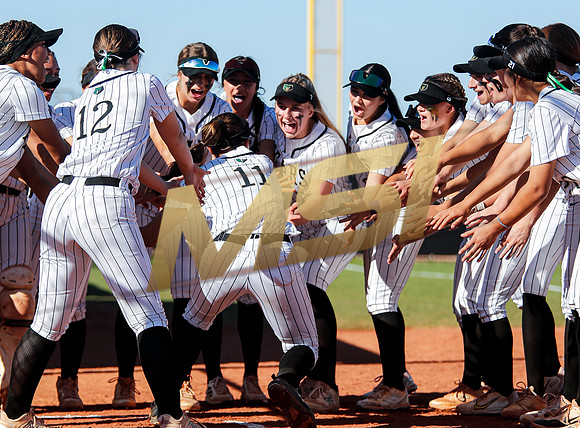The  Red Mountain girls softball team take on the Basha Bears