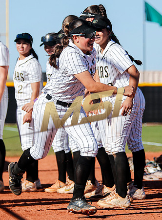 The  Red Mountain girls softball team take on the Basha Bears