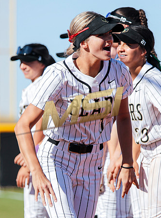 The  Red Mountain girls softball team take on the Basha Bears