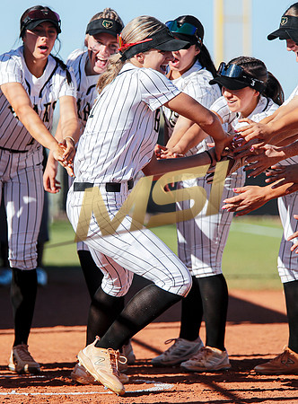 The  Red Mountain girls softball team take on the Basha Bears