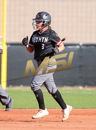 The  Red Mountain girls softball team take on the Basha Bears