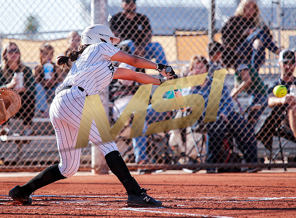 The  Red Mountain girls softball team take on the Basha Bears