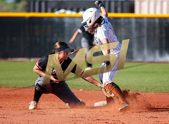 The  Red Mountain girls softball team take on the Basha Bears