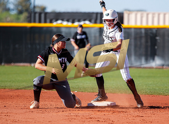 The  Red Mountain girls softball team take on the Basha Bears