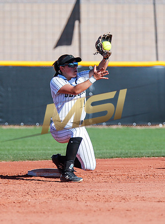 The  Red Mountain girls softball team take on the Basha Bears