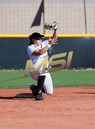 The  Red Mountain girls softball team take on the Basha Bears