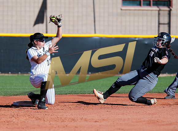 The  Red Mountain girls softball team take on the Basha Bears
