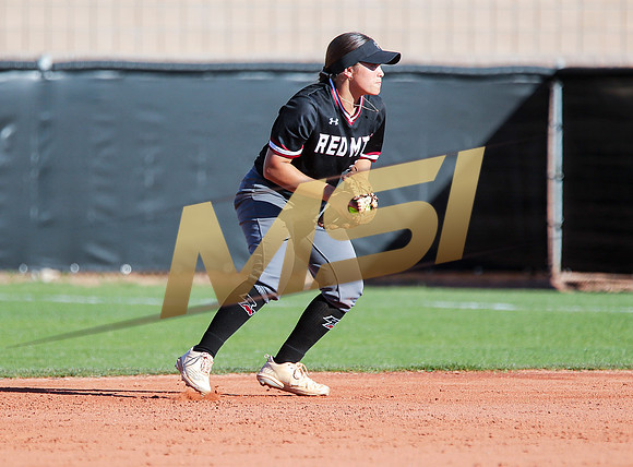 The  Red Mountain girls softball team take on the Basha Bears