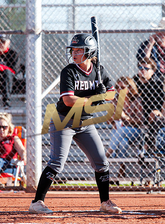 The  Red Mountain girls softball team take on the Basha Bears