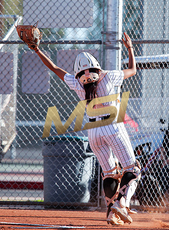 The  Red Mountain girls softball team take on the Basha Bears