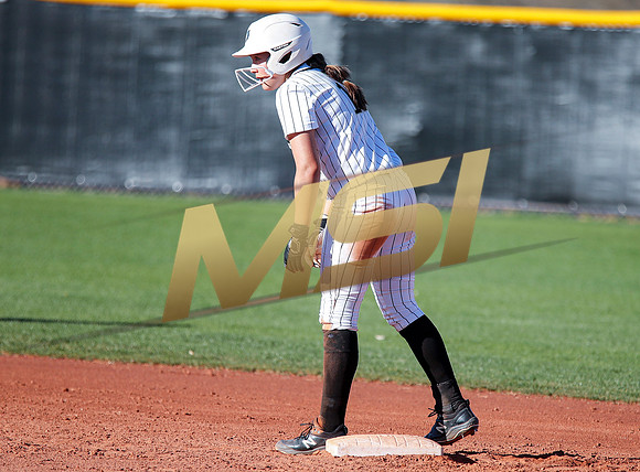 The  Red Mountain girls softball team take on the Basha Bears
